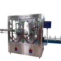 Ligne de production d'eau en bouteille équipement industriel liquide 2000bph eau 3 en 1 machines de remplissage automatiques