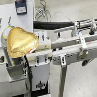 Machine d'emballage de chocolat en forme de cœur avec feuille d'aluminium, haute capacité, scellage thermique entièrement automatique, conception personnalisée