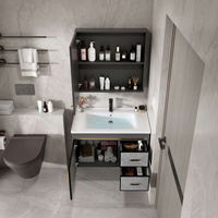 Ensemble de meuble-lavabo mural en aluminium gris foncé avec aspect marbre, porte en pierre frittée, vasque sous plan et miroir LED