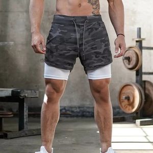 Pantalon de jogging double couche 2-en-1 pour homme, idéal pour l'entraînement sportif estival, avec poches multiples, coupe ajustée à l'intérieur et ample à l'extérieur. - Product Image 1