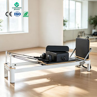 Peralatan Gym Boutique Sistem Peredam Getaran Silent Springs Glide System Reformer Pilates Kayu Aluminium Hibrida Mewah Bersertifikasi CE ISO
