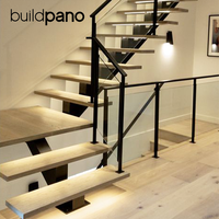 Escalier contemporain en acier à une seule poutre avec marches en noyer et balustrade en verre pour projets de duplex et de maisons jumelées