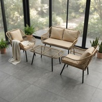 Ensemble de salon de jardin quatre pièces en rotin synthétique moderne avec structure en fer, couleur personnalisable, pour hôtel et cour.