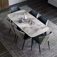 Table de salle à manger minimaliste moderne en pierre frittée avec pieds en acier carbone pour appartement, vente en gros à prix abordable
