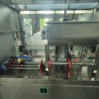 Machine de remplissage de liquides visqueux, machine de remplissage de sauces et de pâtes, machine de remplissage automatique de type servo-piston