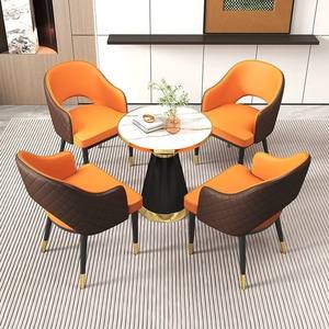 Fauteuil orange moderne avec structure noire et accents dorés pour salon ou salle à manger - Product Image 2