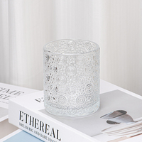 Porte-bougie en verre transparent avec motif floral en relief