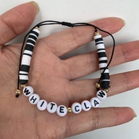 Bracelets de perles de mode transfrontalière noir blanc arc-en-ciel argile douce tissée avec logo de lettre anglaise noeud plat Style noeud péruvien