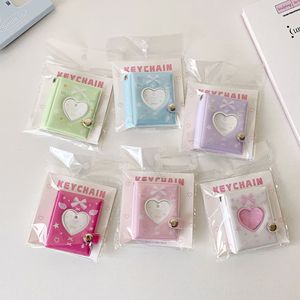 Álbum de fotos con cubierta de PVC de 2 pulgadas con diseño de nudo de mariposa y corazón hueco, colgante de llavero boutique, álbum de almacenamiento de pegatinas para estudiantes y mujeres - Product Image 2