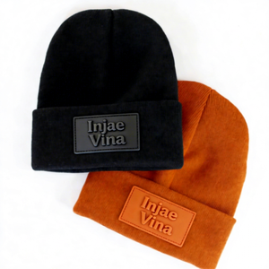 OEM Vente en gros Bonnets d'hiver tricotés personnalisés de haute qualité avec patch en cuir, design classique décontracté et chaud pour l'extérieur - Product Image 1