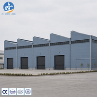 Centre de distribution logistique en structure métallique, portique multi-ports, mezzanine en option, conception, fabrication et installation