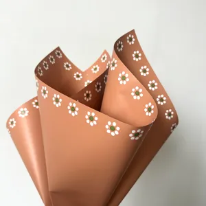 Fábrica al por mayor nuevo patrón de flores de papel marrón impreso en el lado impreso ambos lados barro papel de regalo floral para flores
