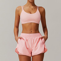 XW-TZ4001 Ensemble de yoga deux pièces avec short de sport à poches latérales et soutien-gorge croisé sans dos pour fitness, course et gym