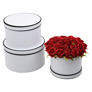 Characteristic round set of three flowers gift box holding bucket