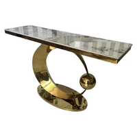 Table à manger en pierre frittée de luxe avec support en acier doré, design moderne pour la maison et l'hôtellerie