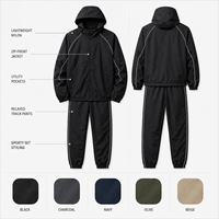 Ensemble de survêtement léger en nylon pour homme, coupe-vent à capuche, veste active zippée et pantalon de survêtement avec passepoil contrastant, vente en gros