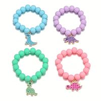 Conjunto de pulsera de color caramelo Popular de cuatro dinosaurios de dibujos animados colgante con cuentas conjunto de pulsera para niños