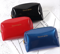 Pochette de maquillage tendance en cuir PU brillant et lisse pour femmes, organiseur à fermeture éclair, trousse de toilette, designs personnalisés, écologique