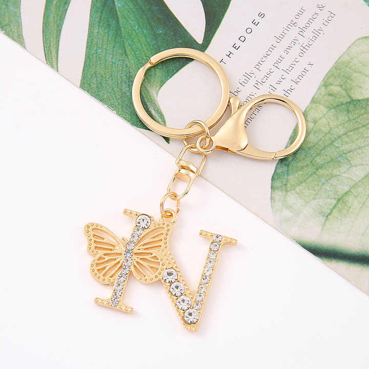 Wholesale Vintage Diamond Butterfly Initial Letter Pendant Fashionable Zinc Alloy Metal Keychain with Cartoon Style