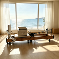 Vente en gros de Reformer Pilates pliable haut de gamme, machine de fitness pour salle de sport, Reformer Pilates pliable en bois de noyer pour studio