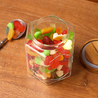 Pot de conservation hexagonal en verre borosilicate de 800 ml avec couvercle en bois d'acacia pour les haricots, les collations, les noix, les biscuits, les chips