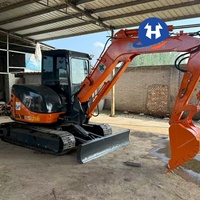 Mini-excavatrice sur chenilles Hitachi ZX65USB-5A d'occasion bien entretenue, modèle 2023, 6,5 tonnes, avec inspection vidéo du moteur, du pompe et des roulements hydrauliques.