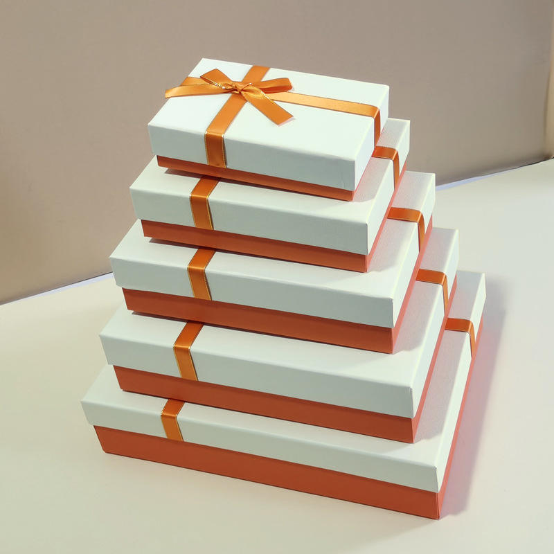 White box with yellow ribbon