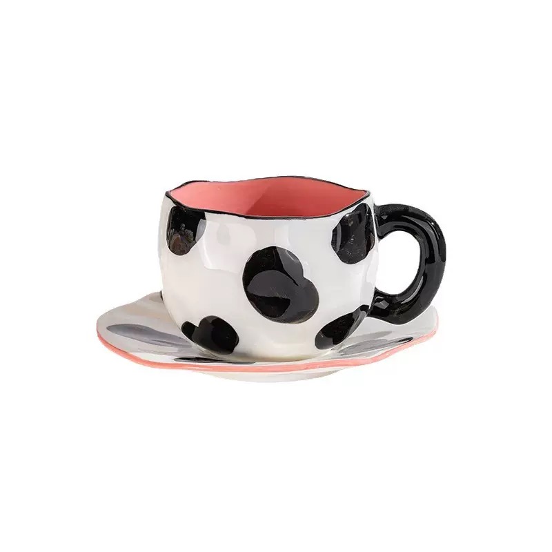 black Cow - Holding cups and plates by hand
