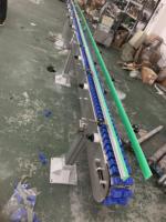 Convoyeurs à chaîne à palette personnalisés pour ligne d'assemblage de convoyage par lots sur mesure avec section de sortie à surface plate