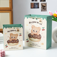 Sac cadeau en papier de texture ours beurre dessin animé haut niveau d'apparence emballage cadeau d'anniversaire sac en papier sac à main souvenir