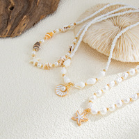 Collier tendance pour femme, style européen et américain, en alliage plaqué or, avec perles et breloques, pendentif coquillage et étoile de mer, idéal pour les soirées