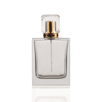 Flacon de parfum carré en verre de 100 ml, forme unique, bords fins, fond épais, avec impression sérigraphique, bouchon à vis et pompe pulvérisatrice