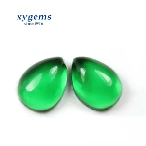 Wuzhou Xiangyi Gems clear glass cabochon sale,emerald color pear cut synthetic crystal glass stones