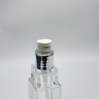 Pompe de traitement d'échelle en argent de haute qualité avec bouchon en argent pour bouteille en verre transparent transparent de 30ml 18mm