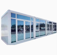Maison conteneur préfabriquée modulaire en acier de 20 pieds avec mur rideau en verre pour bureau, studio, jardin, extérieur