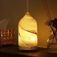 Diffuseur d'huiles essentielles électrique en verre effet roche sablée avec 7 lumières LED pour une utilisation intérieure à la maison