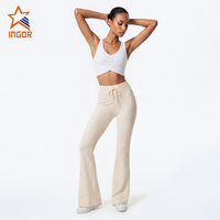 Ensemble de yoga 2 pièces pour femme avec logo personnalisé, soutien-gorge de sport froncé et leggings évasés en nylon et élasthanne, doux comme du beurre, coupe bootcut, pour la gym et le fitness