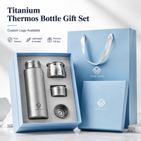 Vente en gros de bouteilles isothermes en titane pur de 420 ml, ensemble cadeau, couvercle magnétique, tasse isotherme, logo personnalisé pour les cadeaux d'entreprise