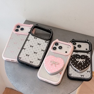 เคสโทรศัพท์ลายการ์ตูนคิตตี้รูปโบว์เพชรแบบใหม่ล่าสุดสำหรับสาวๆ วัสดุ TPU+อะคริลิค ป้องกันรอยนิ้วมือ กันกระแทก พร้อมกระจกแต่งหน้าแบบพับได้ - Product Image 1