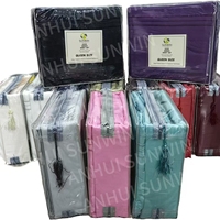 En stock : Ensemble de literie 4 pièces en polyester, couleur unie (bleu foncé, gris, noir), finition lavée et poncée, comprenant drap-housse et housse de couette.