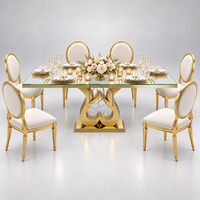 Table à manger moderne en acier inoxydable doré avec plateau en verre transparent, base en forme de cœur, mobilier pour événements et mariages, vente en gros