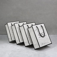 Emballage cosmétique de cadeau de bijoux de mode de luxe écologique sac en papier blanc avec poignées en ruban