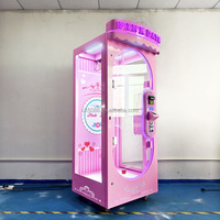 Machine à prix à ciseaux verticale commerciale à monnayeur, avec bordure néon rose et roue mobile, pour centre commercial et salle d'arcade, garantie 1 an