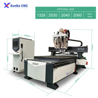 Xunke Machine multifonctionnelle de routeur de commande numérique par ordinateur d'emboîtement 4 têtes 6kw machine de routeur de bois de Atc de changement automatique de broche pour l'armoire