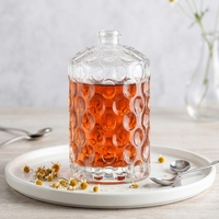 Bouteille en verre de vodka personnalisée avec motif en relief, 700 ml, 750 ml, bouteilles à spiritueux transparentes rondes en verre silex, vente en gros