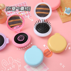 Mini cepillo plegable para el cabello con cojín de aire y espejo, cepillo de masaje redondo de nailon para el cuidado del cuero cabelludo, diseño compacto y portátil - Product Image 1