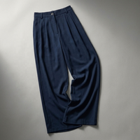 Fabricant de pantalons plissés taille haute bleu marine sur mesure OEM ODM pour femmes, pantalons de costume décontractés et fluides pour le bureau