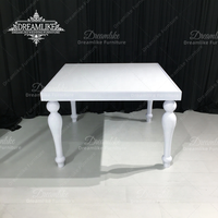 Table de salle à manger moderne d'extérieur en fer peint blanc avec plateau en MDF, durable, de la marque Dreamlike, idéale pour les mariages, événements et hôtels