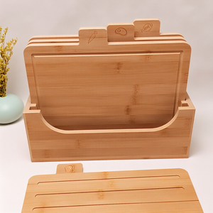 Four-piece bamboo cutting board set arranged by size on countertop