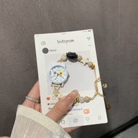 Petite montre-bracelet en alliage pour femme, écologique, artistique, à mouvement à quartz, style dessin animé mignon et de niche, idéale pour les meilleures amies et les étudiantes